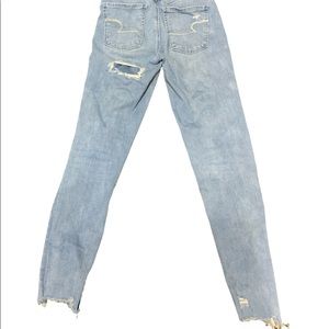 Blue distressed skinny jeans